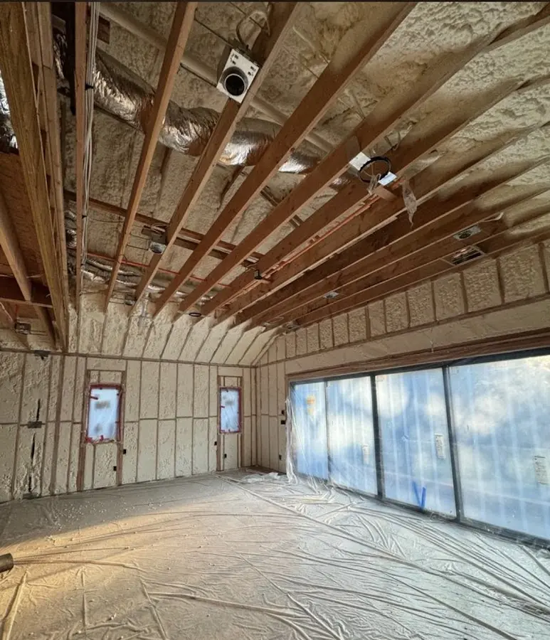 Interior walls and ceiling insulated with spray foam during new construction in Homewood
